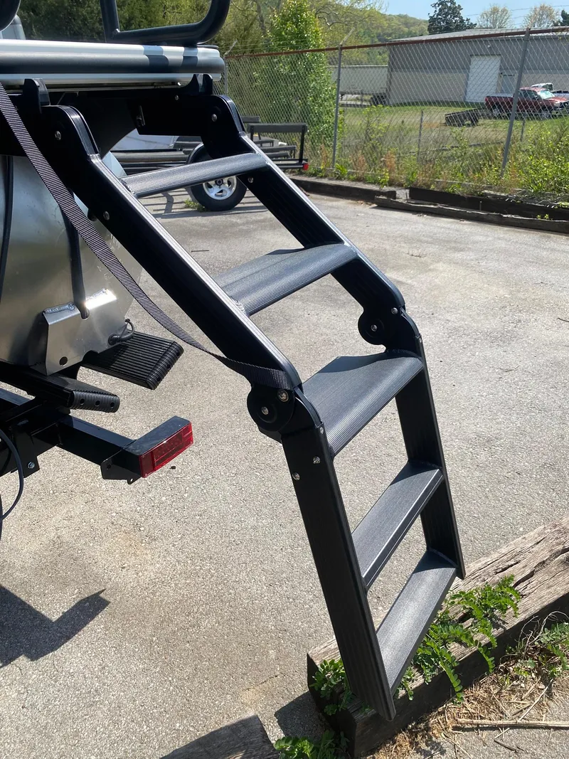 Slide: The Image of 2025 Bentley Pontoons Legacy 223 Navigator ladder, outdoor setting, sunny day. - 11