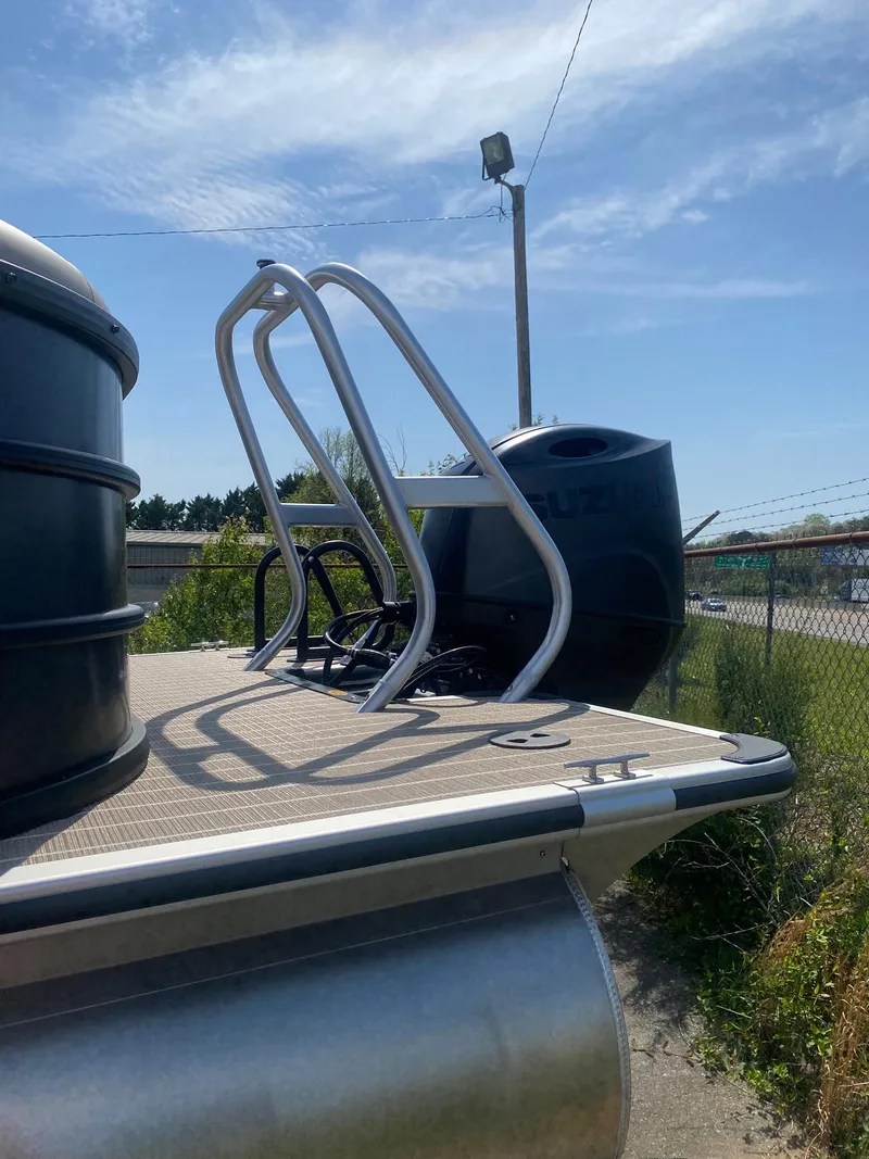 Slide: The Image of 2025 Bentley Pontoons Legacy 223 Navigator with sleek design and sturdy ladder. - 18