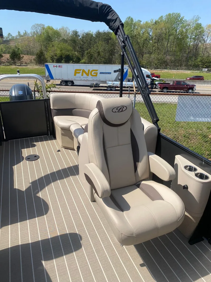 Slide: The Image of 2025 Bentley Pontoons Legacy 223 Navigator interior with luxurious seating and modern design. - 26