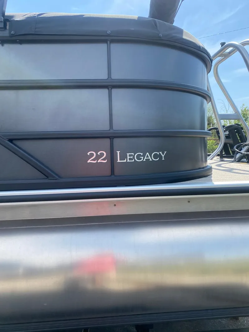 Slide: The Image of 2025 Bentley Pontoons Legacy 223 Navigator, sleek design with "22 Legacy" branding. - 3