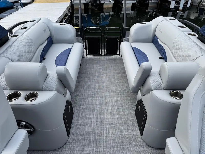 Slide: The Image of Luxurious interior of 2025 JC SportToon 24 TT DSL pontoon boat with plush seating and cup holders. - 13