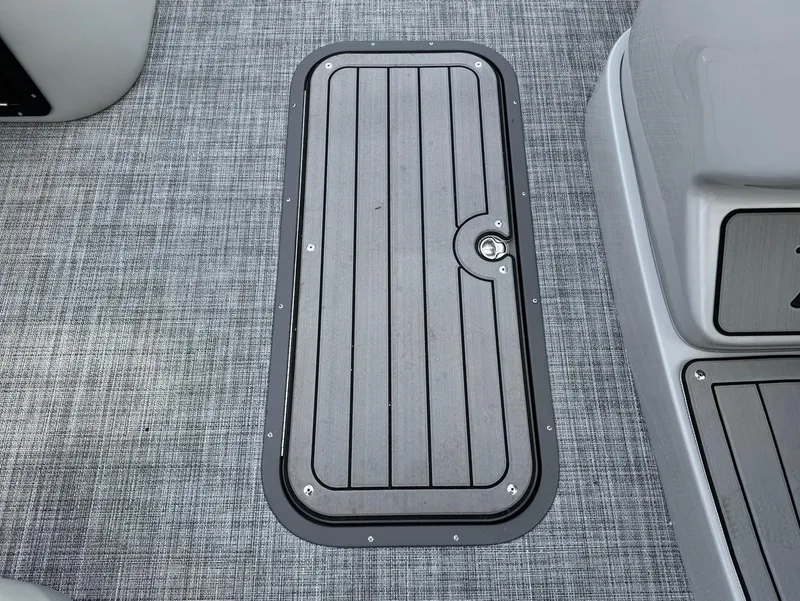 Slide: The Image of 2025 JC SportToon 24 TT DSL boat deck with sleek hatch design. - 3