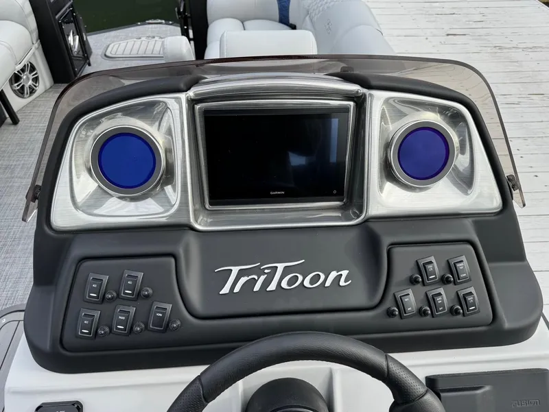 Slide: The Image of Dashboard of 2025 JC SportToon 24 TT DSL boat with controls and display. - 11