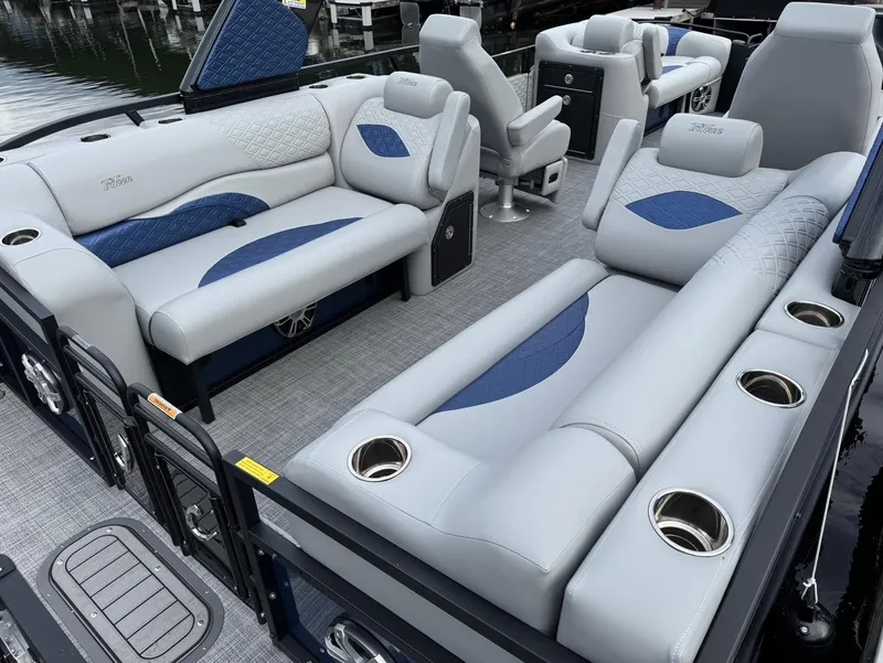 Slide: The Image of Luxurious 2025 JC SportToon 24 TT DSL pontoon boat with plush seating and cup holders. - 16
