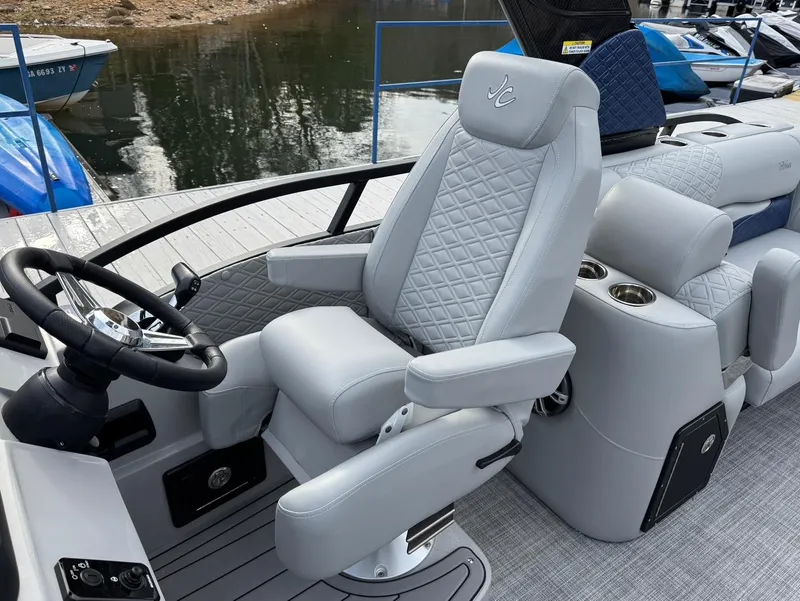 Slide: The Image of Luxury seating on 2025 JC SportToon 24 TT DSL pontoon boat, featuring quilted upholstery. - 9