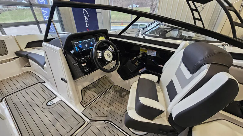 Slide: The Image of 2021 Yamaha Boats 212SD cockpit with modern dashboard and comfortable seating. - 12