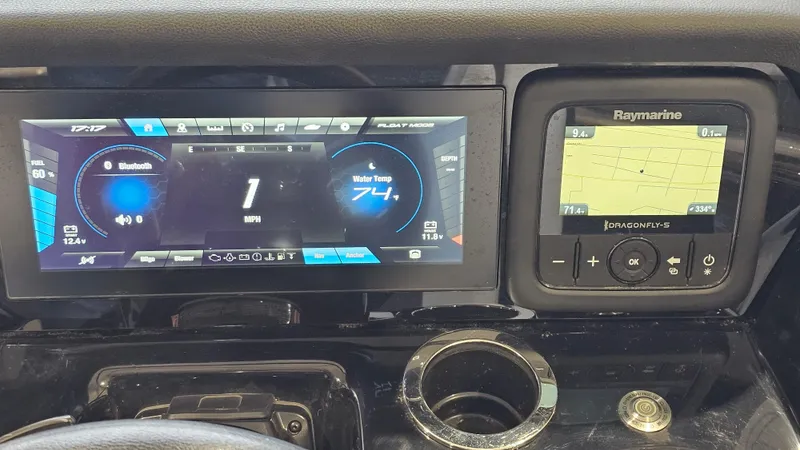 Slide: The Image of Dashboard of 2021 Yamaha Boats 212SD with digital displays and navigation system. - 14