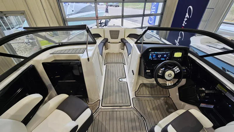 Slide: The Image of 2021 Yamaha Boats 212SD interior with modern dashboard and seating. - 16