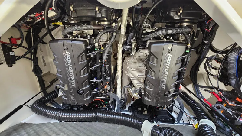 Slide: The Image of 2021 Yamaha Boats 212SD engine compartment with dual engines and wiring. - 23