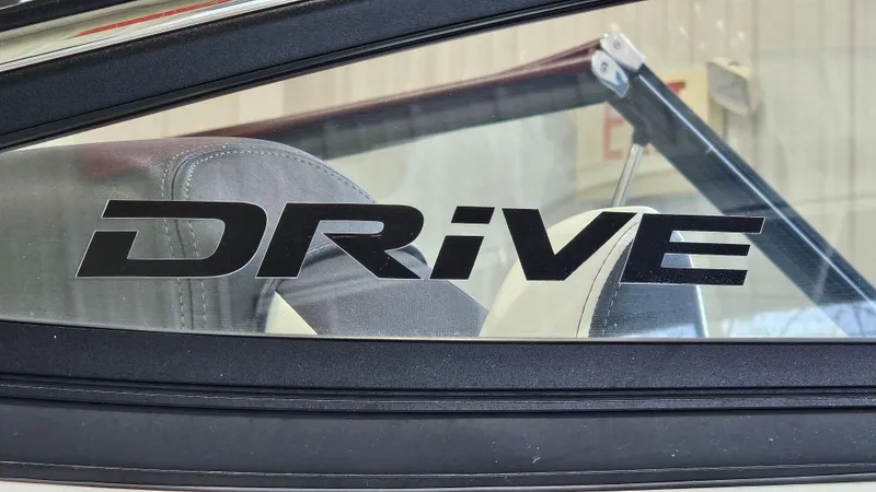Slide: The Image of Yamaha Boats 2021 212SD window with 'Drive' decal in bold lettering. - 30