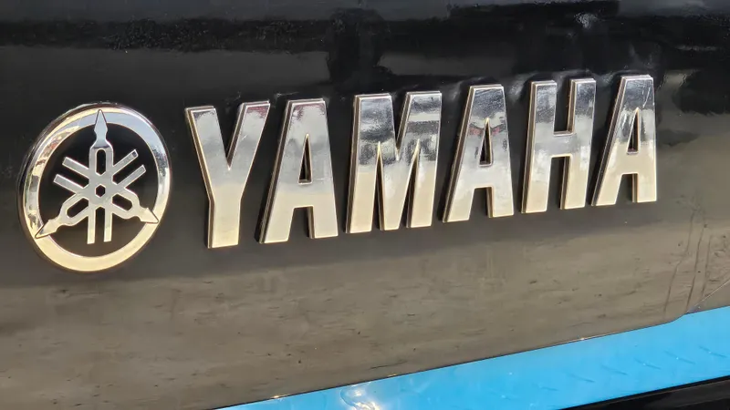 Slide: The Image of Yamaha logo on 2021 Yamaha Boats 212SD, featuring sleek metallic lettering. - 31