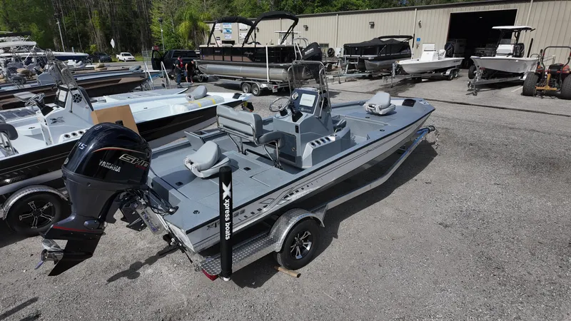 Slide: The Image of 2025 Xpress H20B boat with Yamaha engine in a dealership lot. - 14