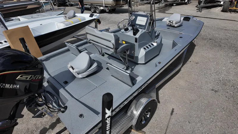 Slide: The Image of 2025 Xpress H20B boat with Yamaha engine, featuring spacious deck and modern controls. - 15
