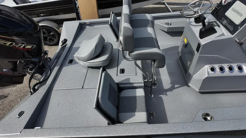 Slide: The Image of 2025 Xpress H20B boat interior with seating and control panel. - 17
