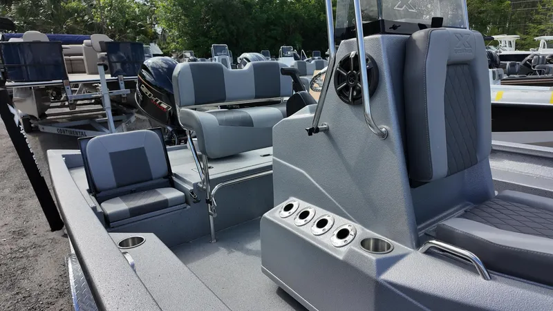 Slide: The Image of 2025 Xpress H20B boat interior with seating and console, featuring modern design and functionality. - 19