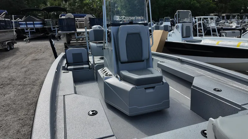 Slide: The Image of 2025 Xpress H20B boat with sleek design and spacious seating, displayed outdoors. - 20