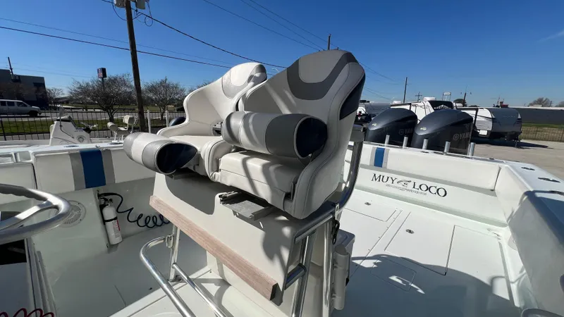 Slide: The Image of 2005 Contender 36 boat interior with dual seats and "Muy Loco" branding. - 11