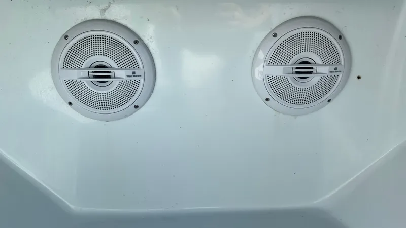 Slide: The Image of Two marine speakers on a 2005 Contender 36 boat interior. - 26