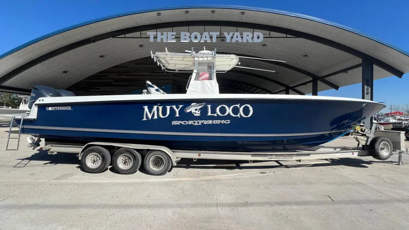 Slide: The Image of 2005 Contender 36 boat on trailer at The Boat Yard. - 28