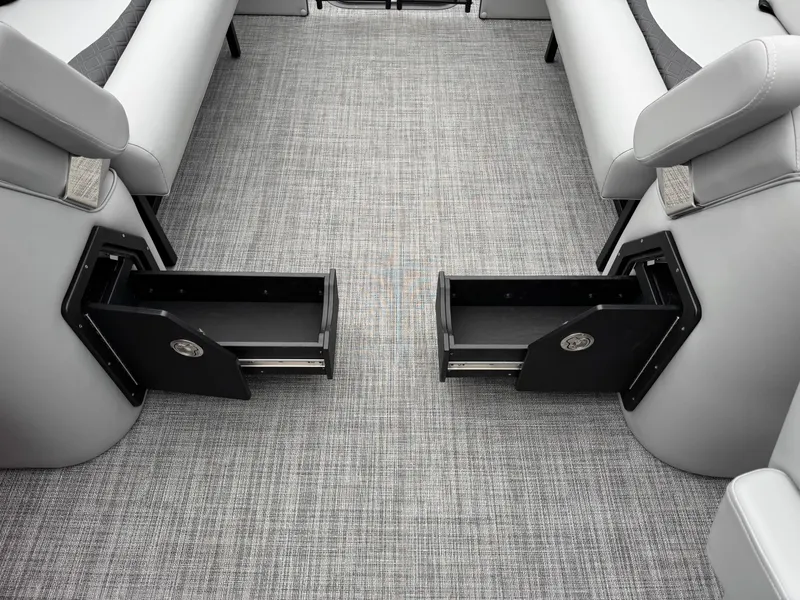 Slide: The Image of Interior view of 2025 JC Neptoon Sport 23TT DSL with open storage compartments. - 21