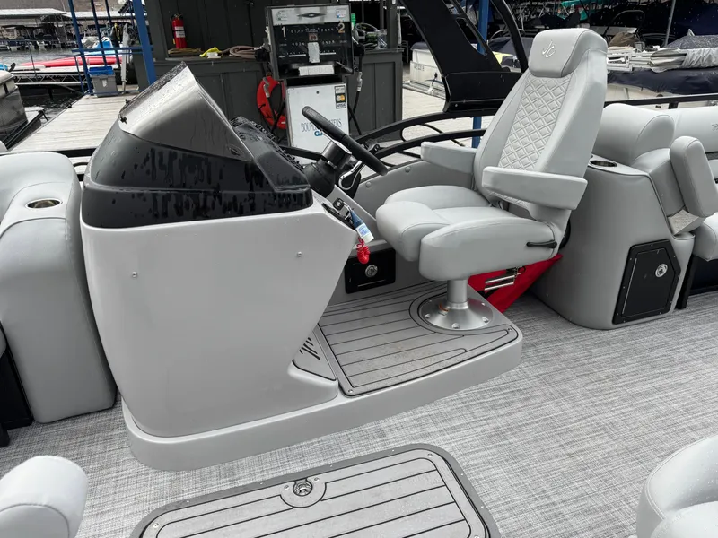Slide: The Image of 2025 JC Neptoon Sport 23TT DSL boat helm with modern controls and comfortable seating. - 6