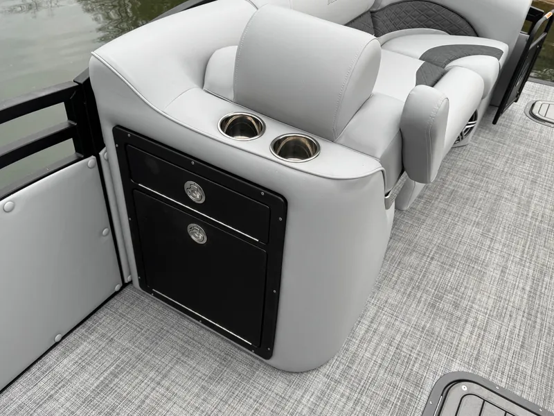 Slide: The Image of 2025 JC Neptoon Sport 23TT DSL boat interior with cup holders and seating. - 15