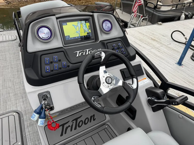 Slide: The Image of Steering console of 2025 JC Neptoon Sport 23TT DSL with navigation display and controls. - 19