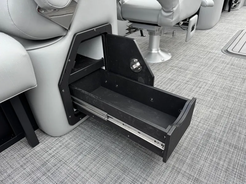 Slide: The Image of Open storage drawer in 2025 JC Neptoon Sport 23TT DSL boat interior. - 3