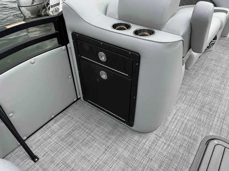 Slide: The Image of 2025 JC Neptoon Sport 23TT DSL boat interior with gray seating and cup holders. - 4