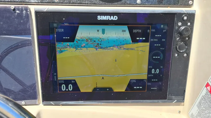 Slide: The Image of Simrad navigation display on 2007 Sea Ray 290 Sundancer boat dashboard. - 23