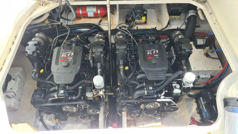 Slide: The Image of Twin engines in a 2007 Sea Ray 290 Sundancer boat engine compartment. - 29