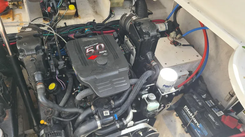 Slide: The Image of Engine compartment of a 2007 Sea Ray 290 Sundancer boat, featuring a 5.0 MPI engine. - 32