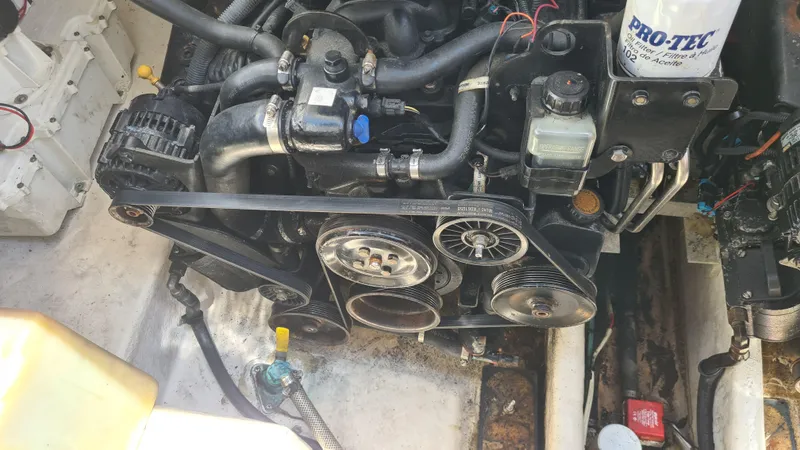 Slide: The Image of Engine compartment of a 2007 Sea Ray 290 Sundancer boat, showing detailed components. - 33