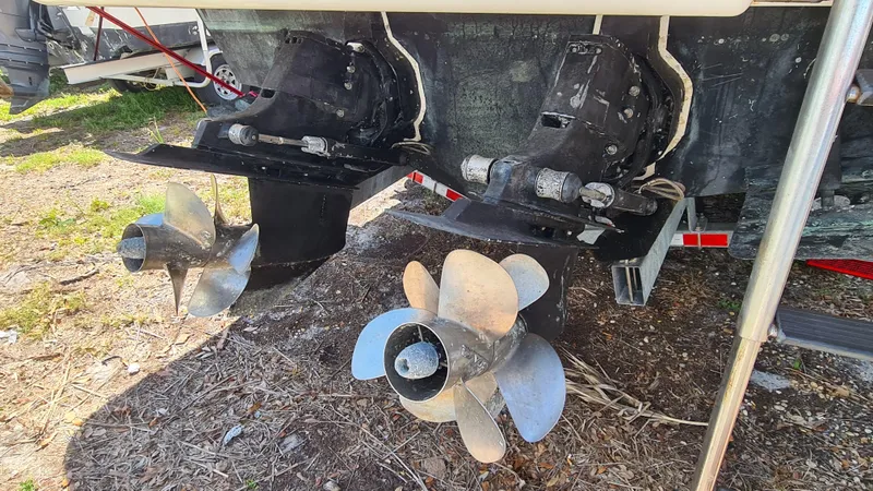 Slide: The Image of 2007 Sea Ray 290 Sundancer dual propellers on dry land. - 35