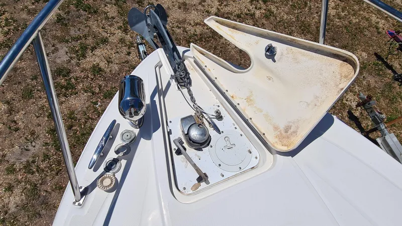 Slide: The Image of 2007 Sea Ray 290 Sundancer anchor compartment with open hatch and accessories. - 4