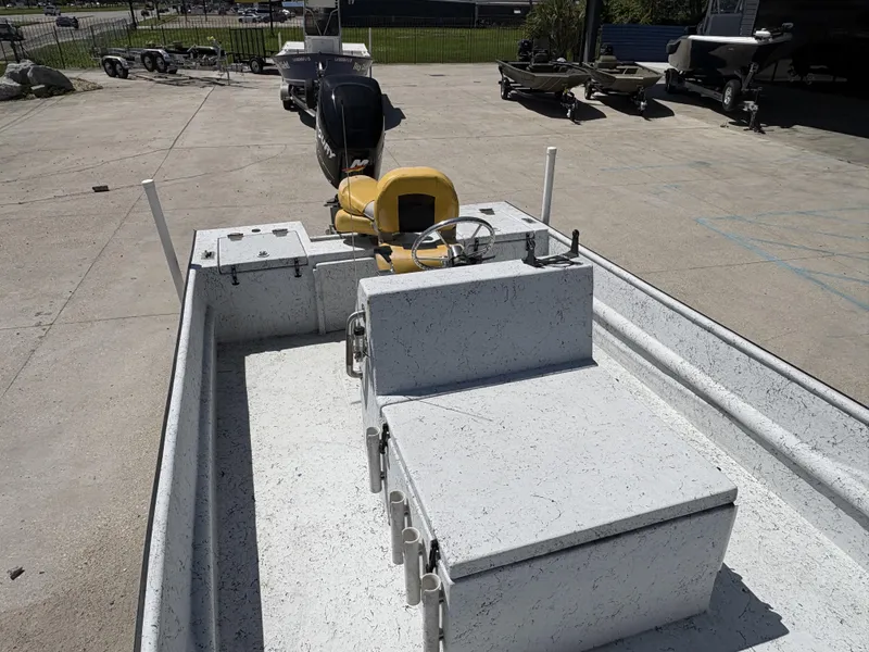 Slide: The Image of 2011 Skiff Reno 22 boat with outboard motor in a parking lot. - 7