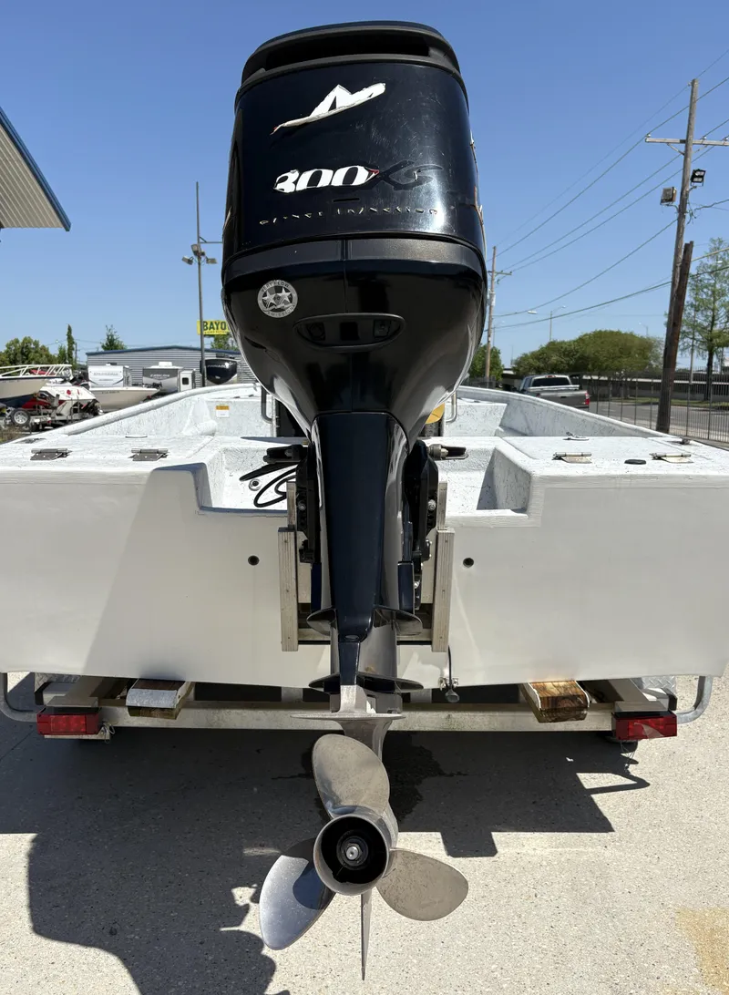 Slide: The Image of 2011 Skiff Reno 22 boat with powerful 300 HP outboard motor on trailer. - 9