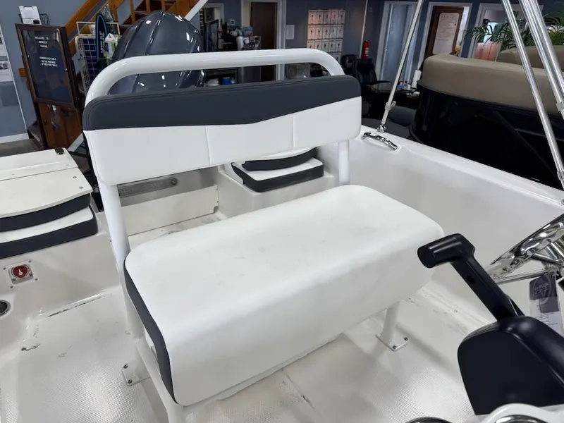 Slide: The Image of 2025 Robalo R160 Center Console boat interior with seating and steering wheel. - 3