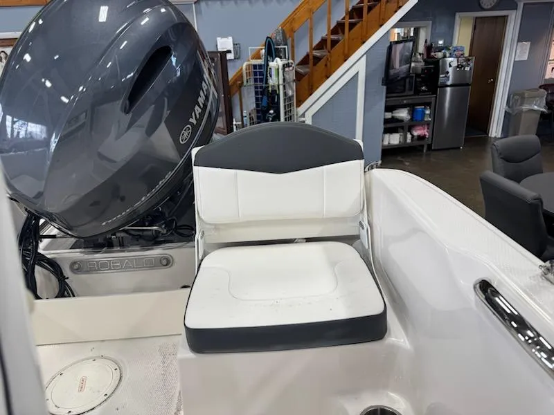 Slide: The Image of 2025 Robalo R160 Center Console boat with Yamaha engine, featuring a comfortable white seat. - 5