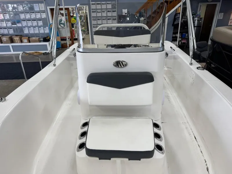 Slide: The Image of 2025 Robalo R160 Center Console boat interior with seating and console view. - 7