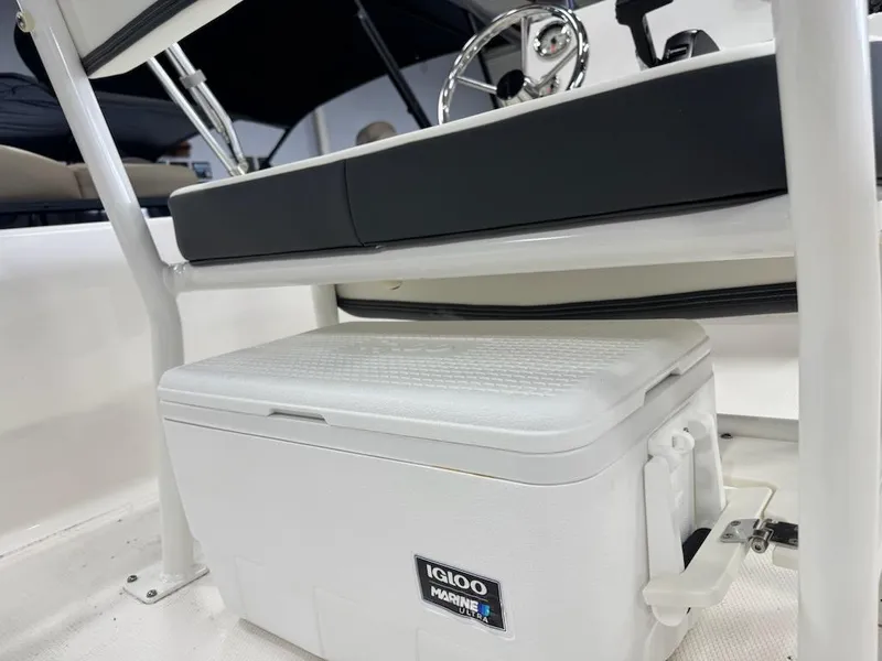 Slide: The Image of 2025 Robalo R160 Center Console with Igloo Marine cooler under seat. - 8