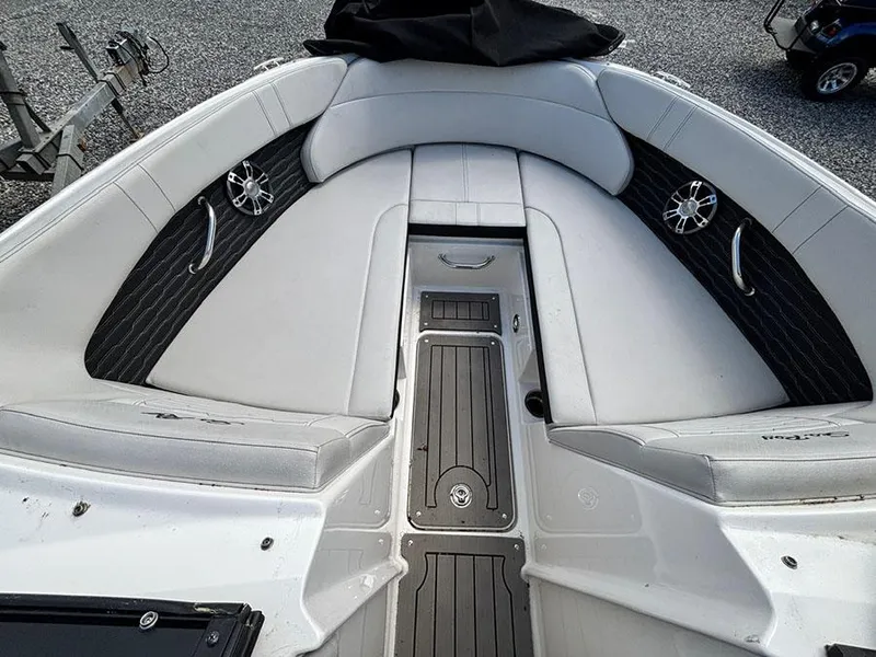 Slide: The Image of 2022 Sea Ray SPX 230 boat interior with gray seating and black accents. - 14
