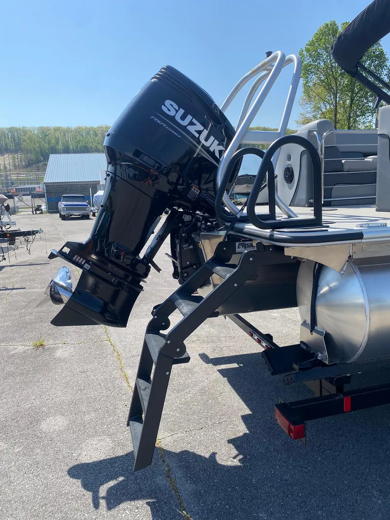Slide: The Image of 2025 Bentley Pontoons Elite 253 Admiral with Suzuki outboard motor and ladder. - 19