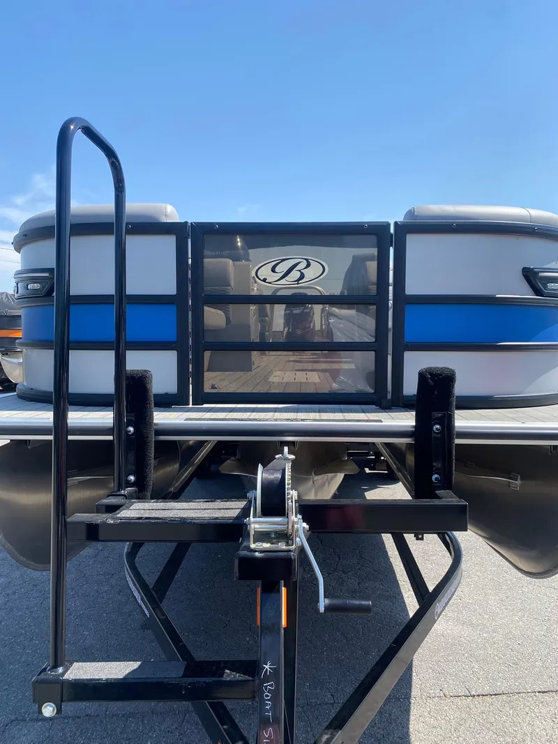 Slide: The Image of 2025 Bentley Pontoons Elite 253 Admiral, rear view, showcasing sleek design and sturdy build. - 21