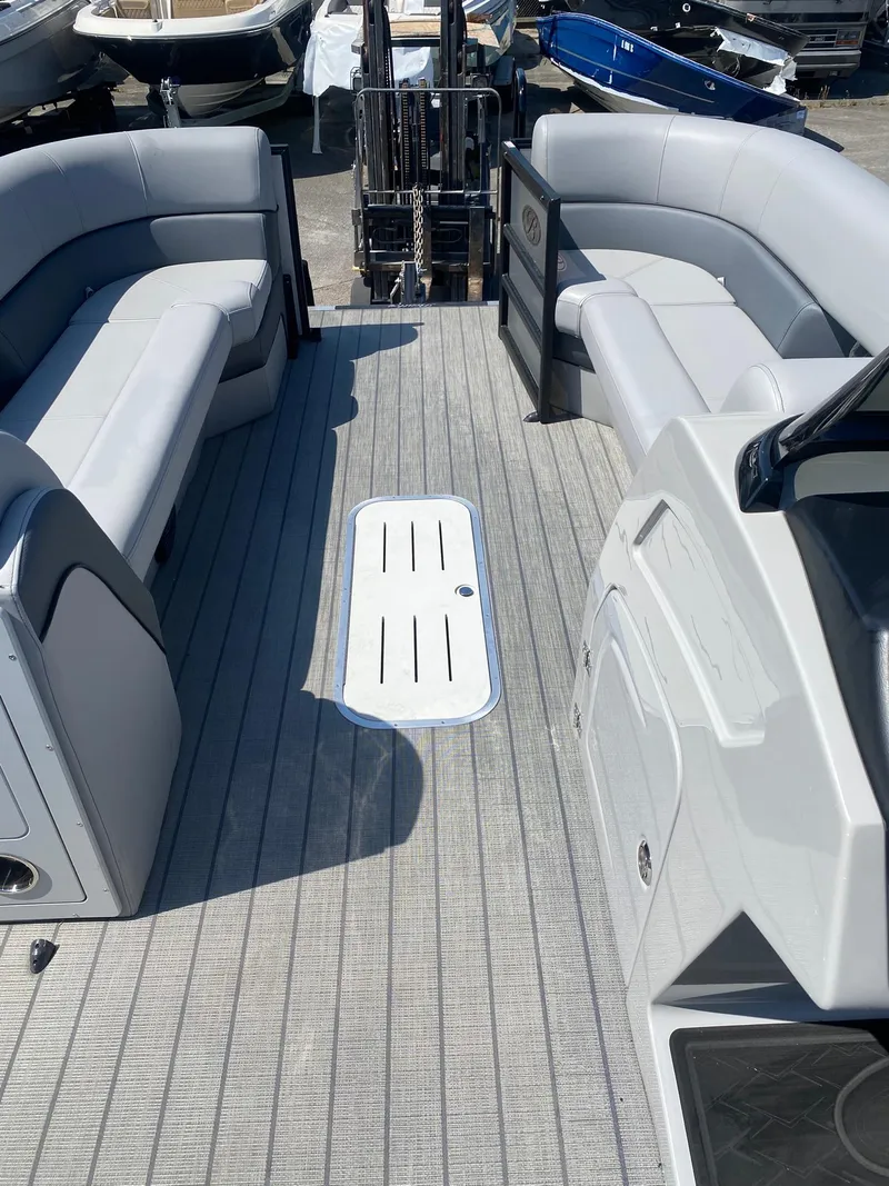 Slide: The Image of 2025 Bentley Pontoons Elite 253 Admiral interior with gray seating and modern design. - 23