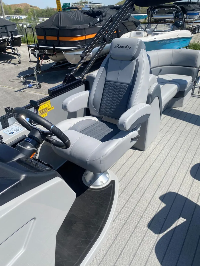 Slide: The Image of 2025 Bentley Pontoons Elite 253 Admiral with luxurious seating and modern helm design. - 27