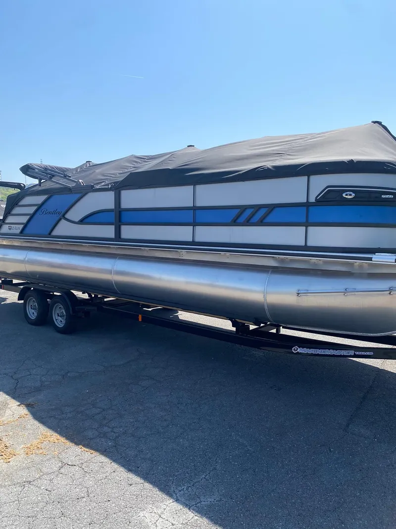 Slide: The Image of 2025 Bentley Pontoons Elite 253 Admiral on trailer, covered, side view. - 9