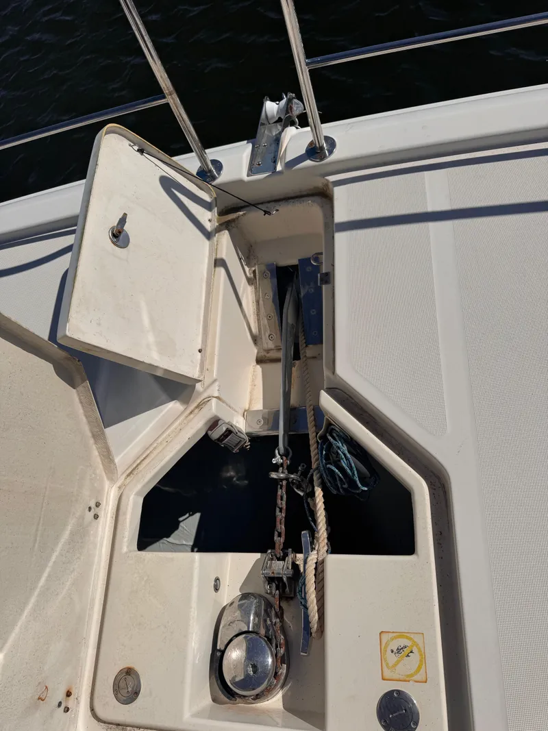 Slide: The Image of Anchor compartment of a 2018 Aquila 48 yacht with open hatch and visible chain. - 18
