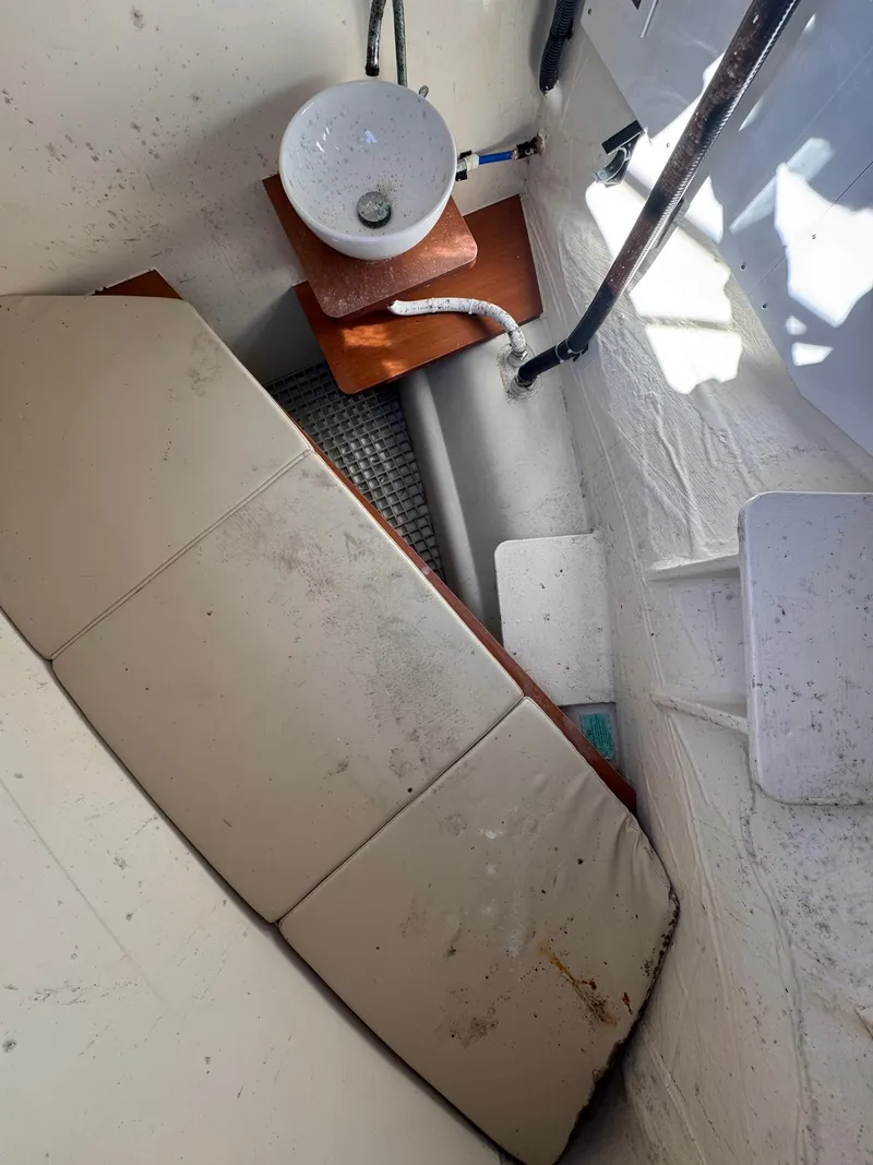 Slide: The Image of Interior of 2018 Aquila 48 boat with sink and cushioned seating area. - 20