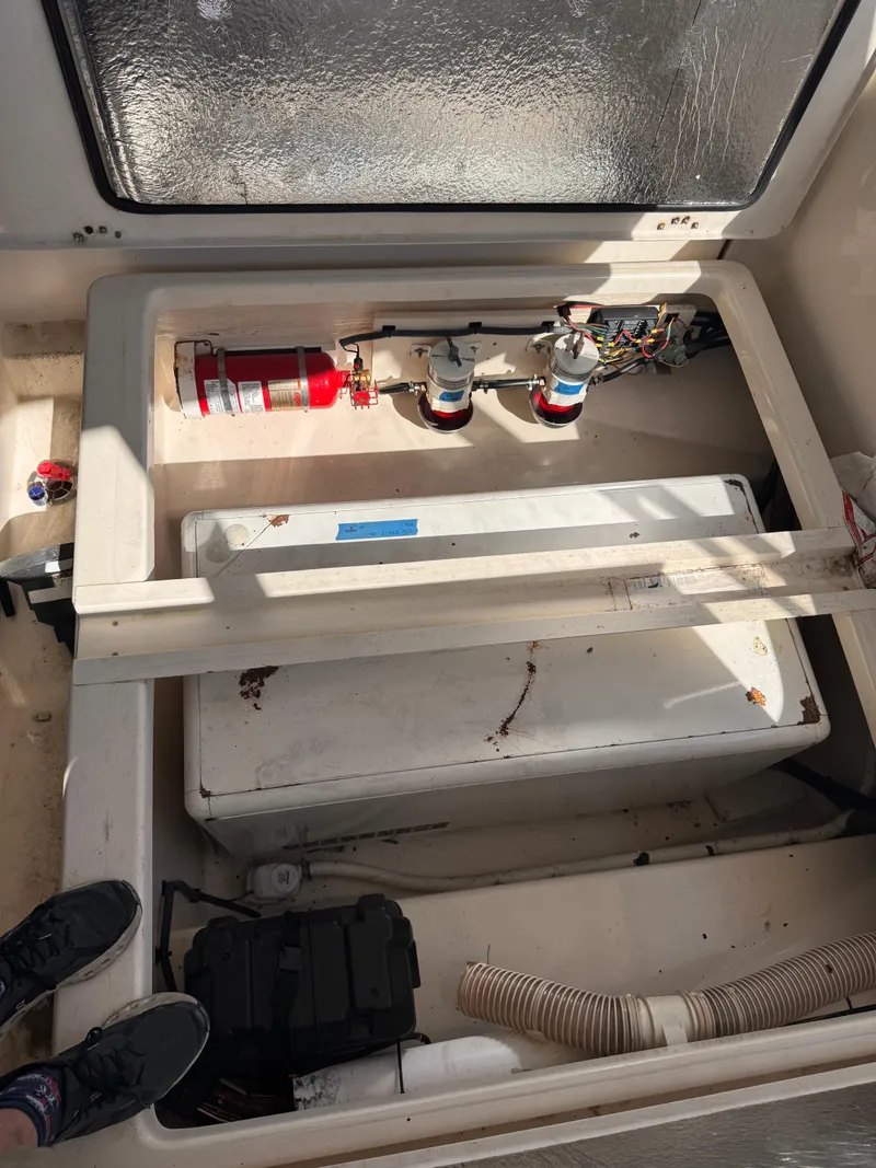 Slide: The Image of Engine compartment of a 2018 Aquila 48 boat with fire extinguisher and equipment. - 22